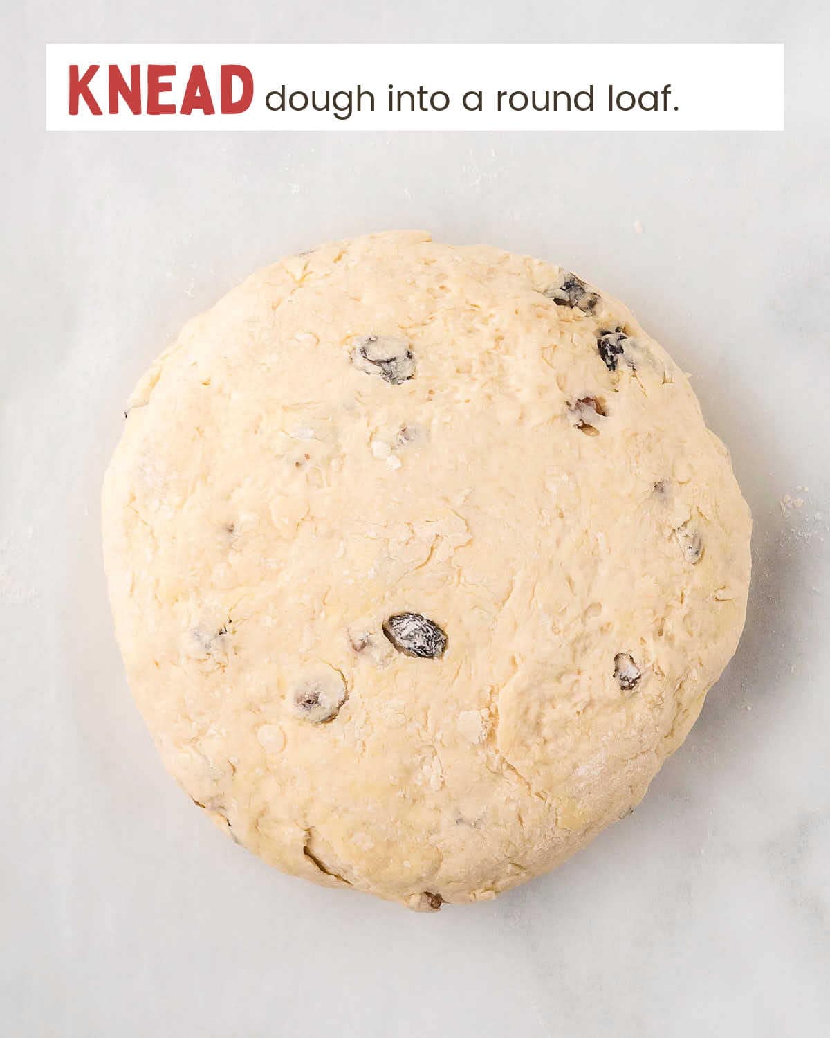 Irish soda bread dough on a marble surface.