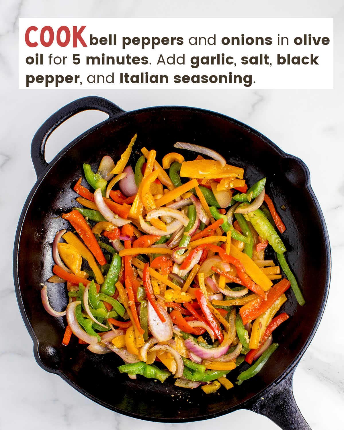 Sliced bell peppers and onions in a cast iron skillet.