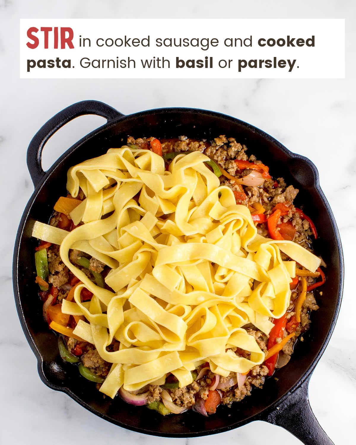 Italian drunken noodles in a cast iron skillet.