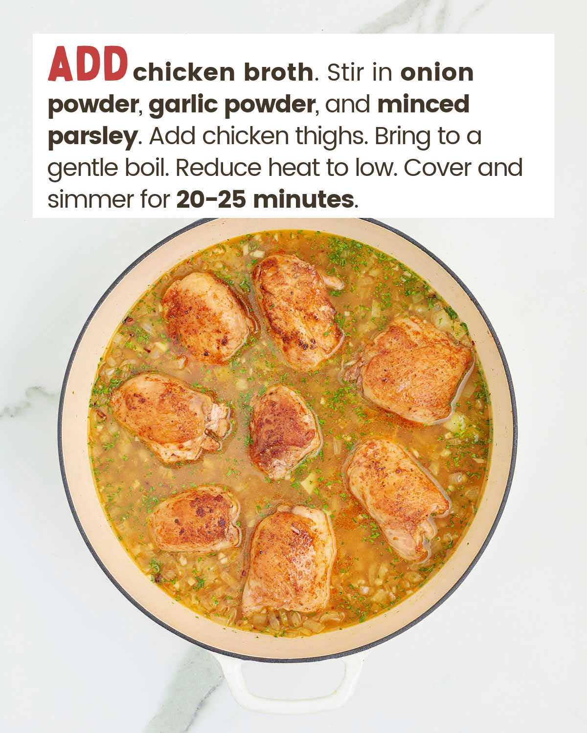 Chicken thighs in a chicken broth and rice mixture in a skillet.
