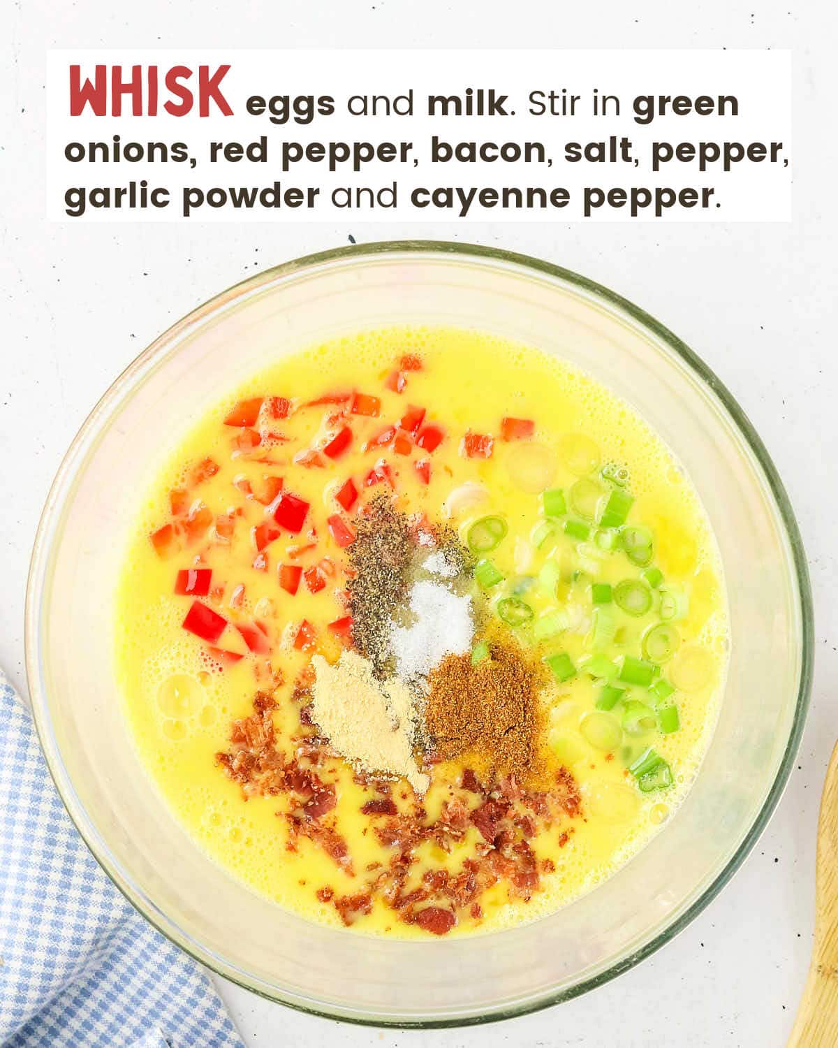 Eggs mixed with milk, red peppers, green onions, and spices.