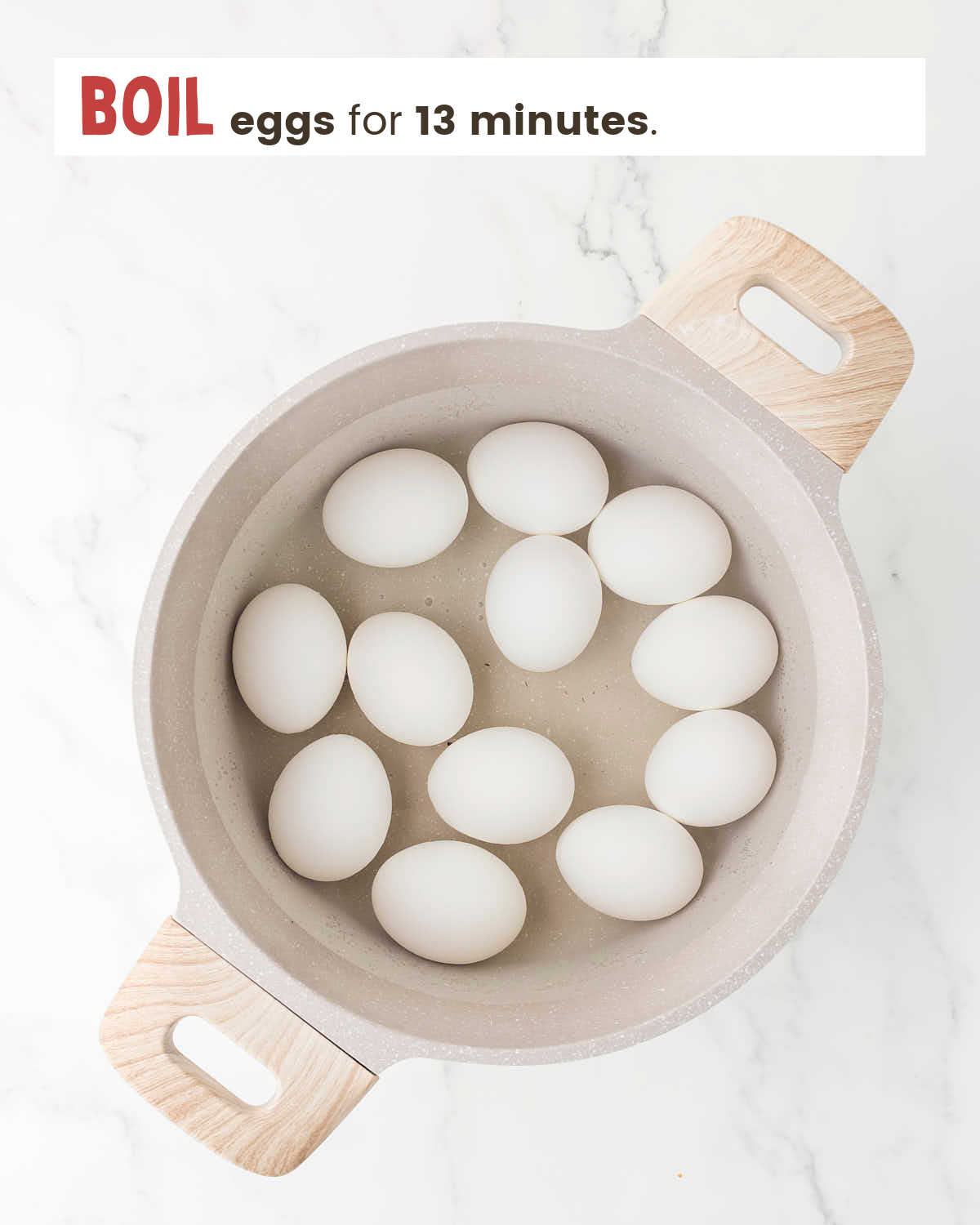Eggs being boiled in a pot. 