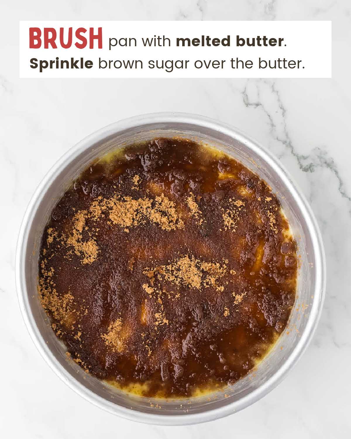 Brown sugar on top of melted butter in a cake pan.