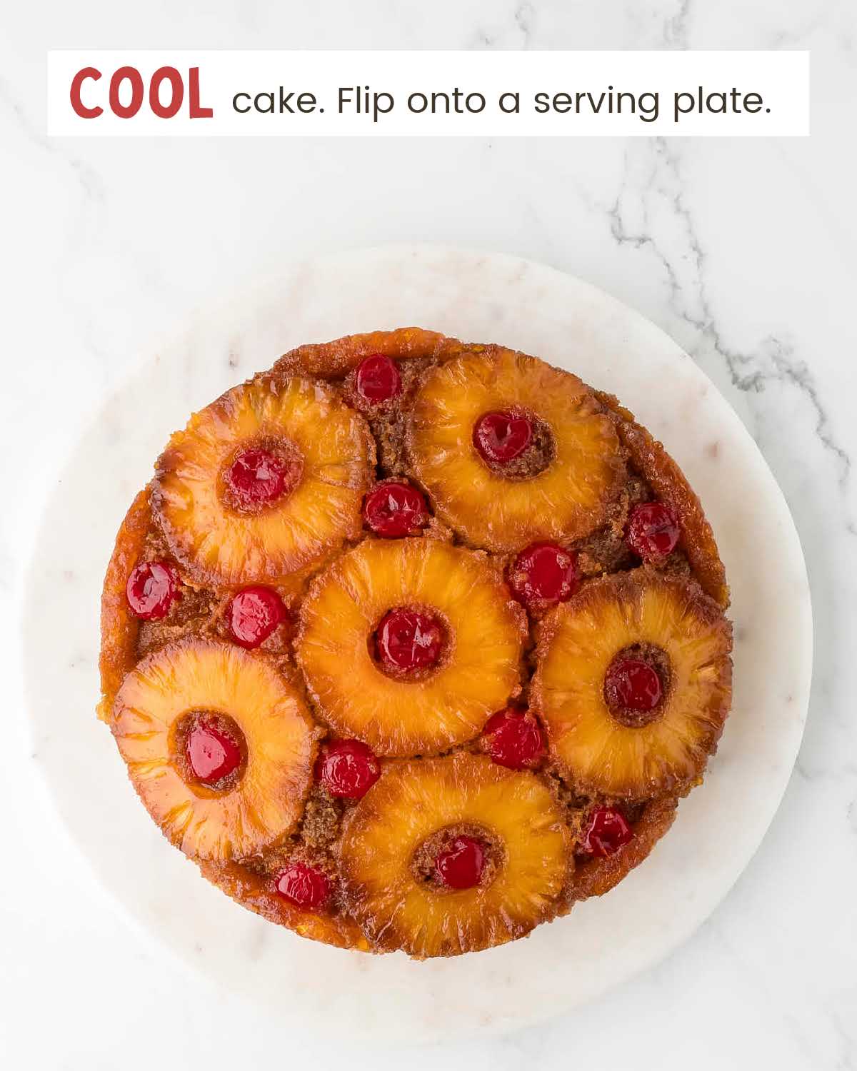 Pineapple upside down cake on a white plate.