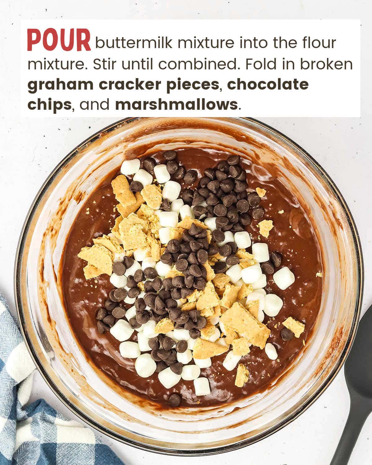 S'mores bread batter topped with graham cracker pieces, chocolate chips, and marshmallows.