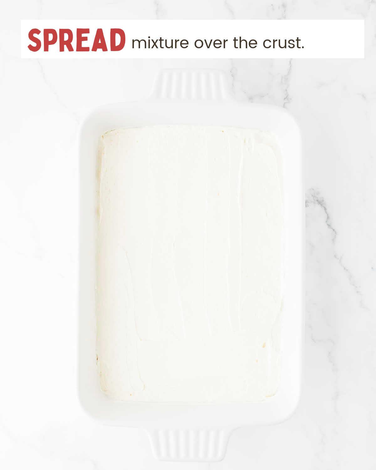 Cream cheese mixture layer in a baking dish.