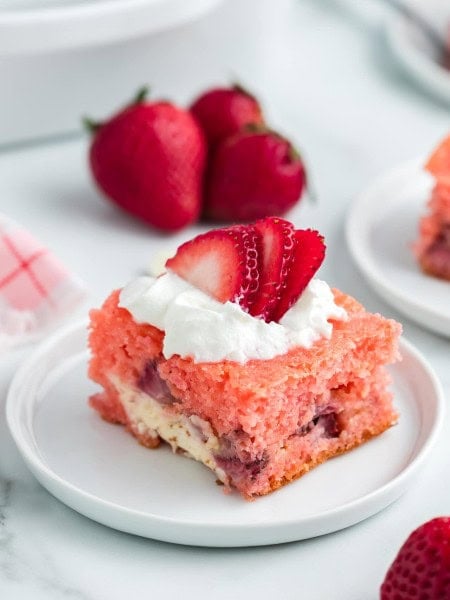 Strawberry Earthquake Cake on a white plate.