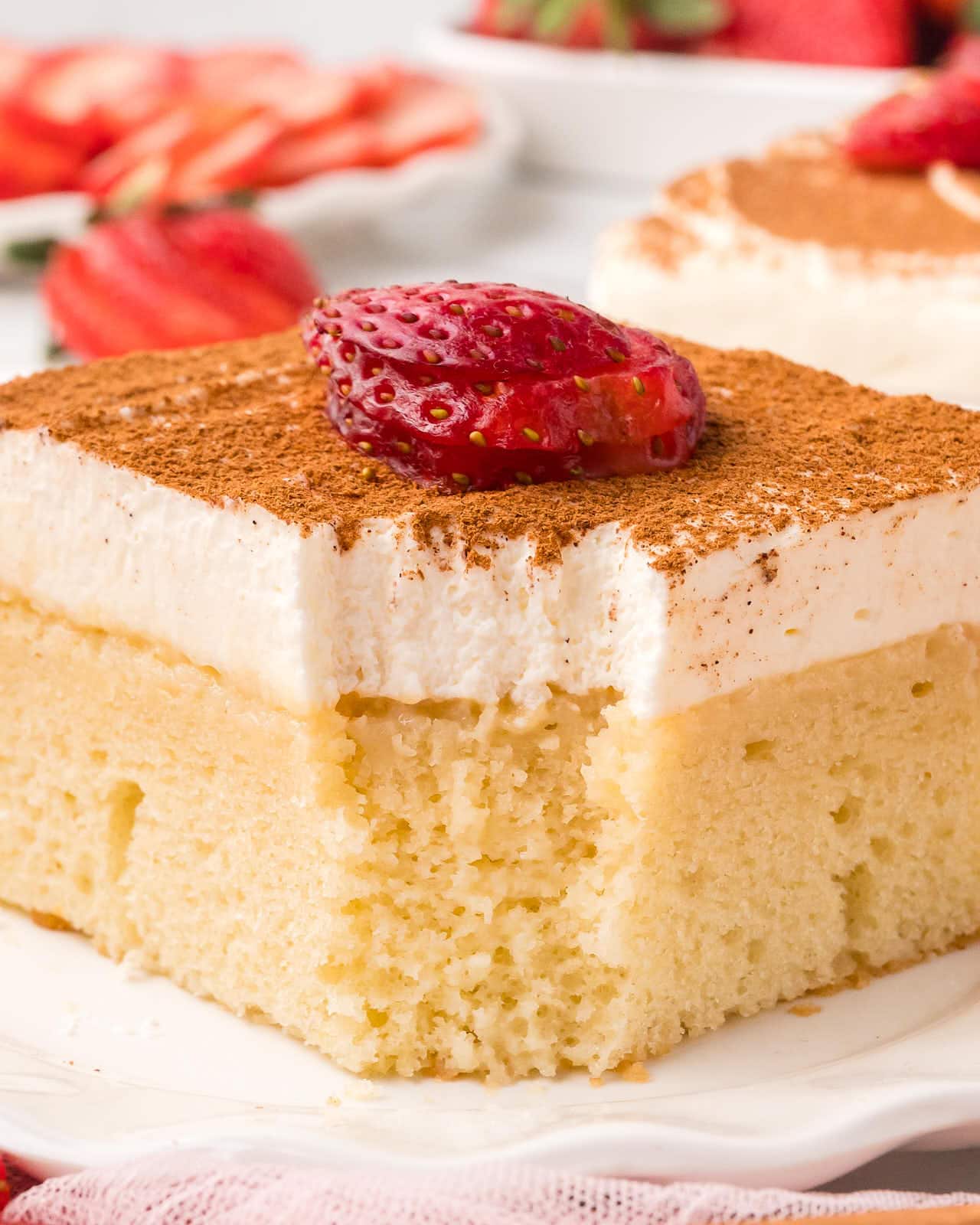 Closeup of a slice of Tres Leches Cake.