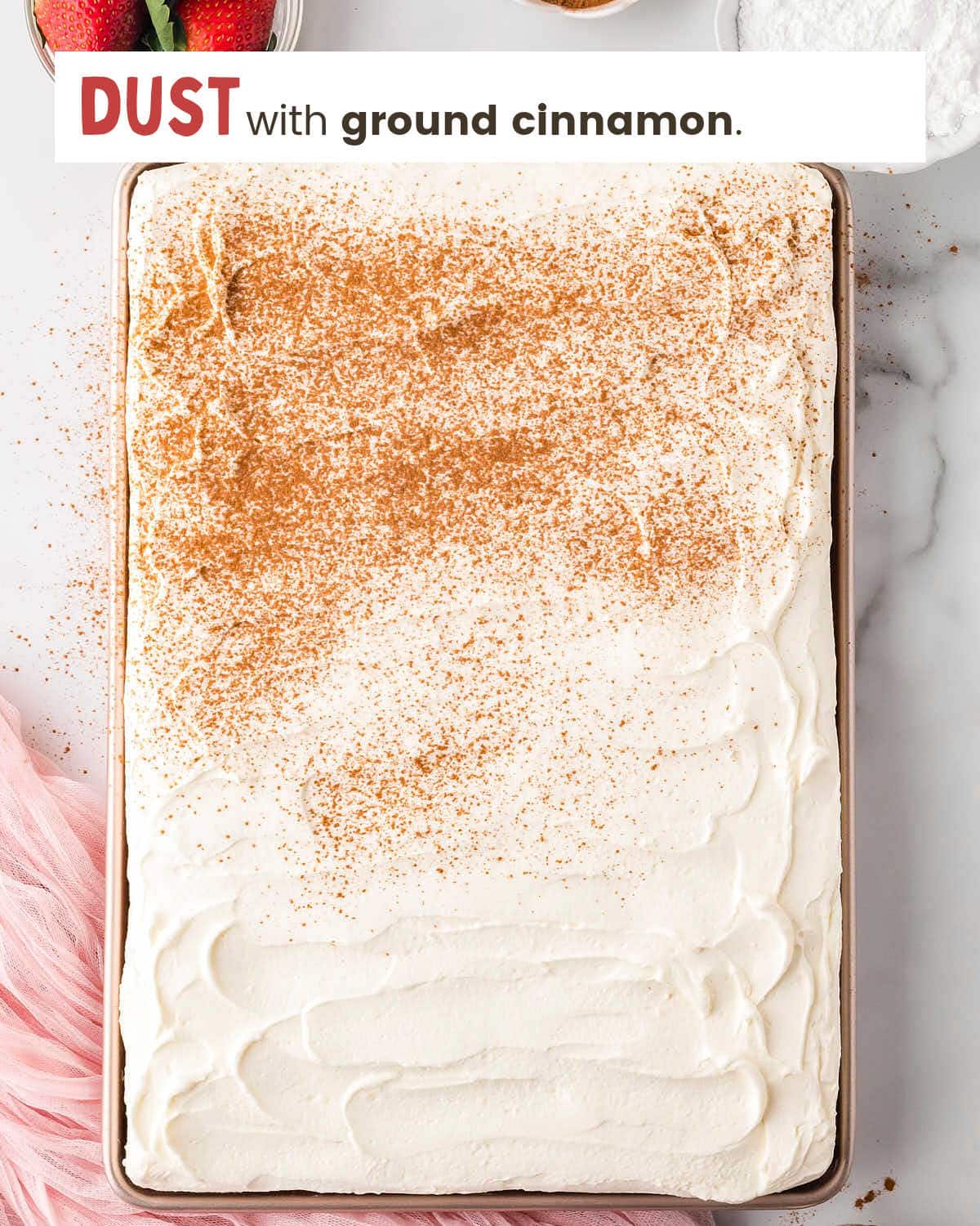 Tres Leches Cake sprinkled with ground cinnamon.