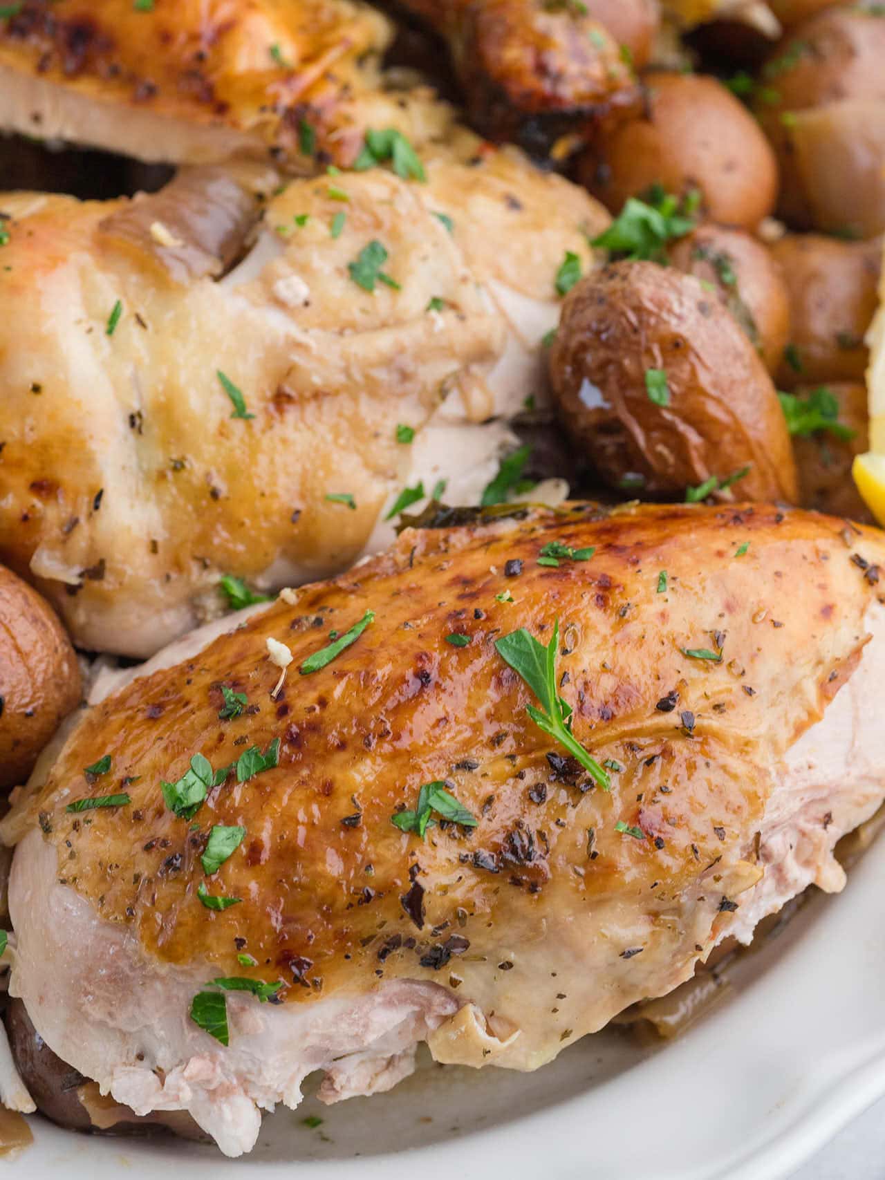 Closeup of a carved sliced chicken thigh.