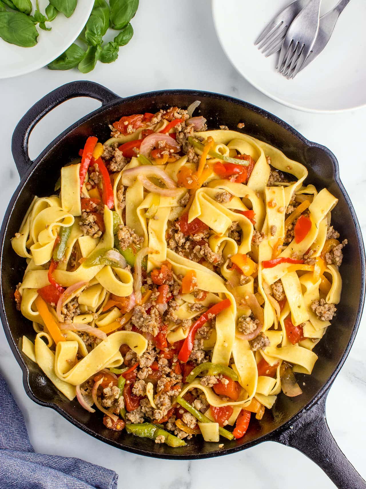 Top down view of Italian Drunken Noodles in a cast iron skillet.