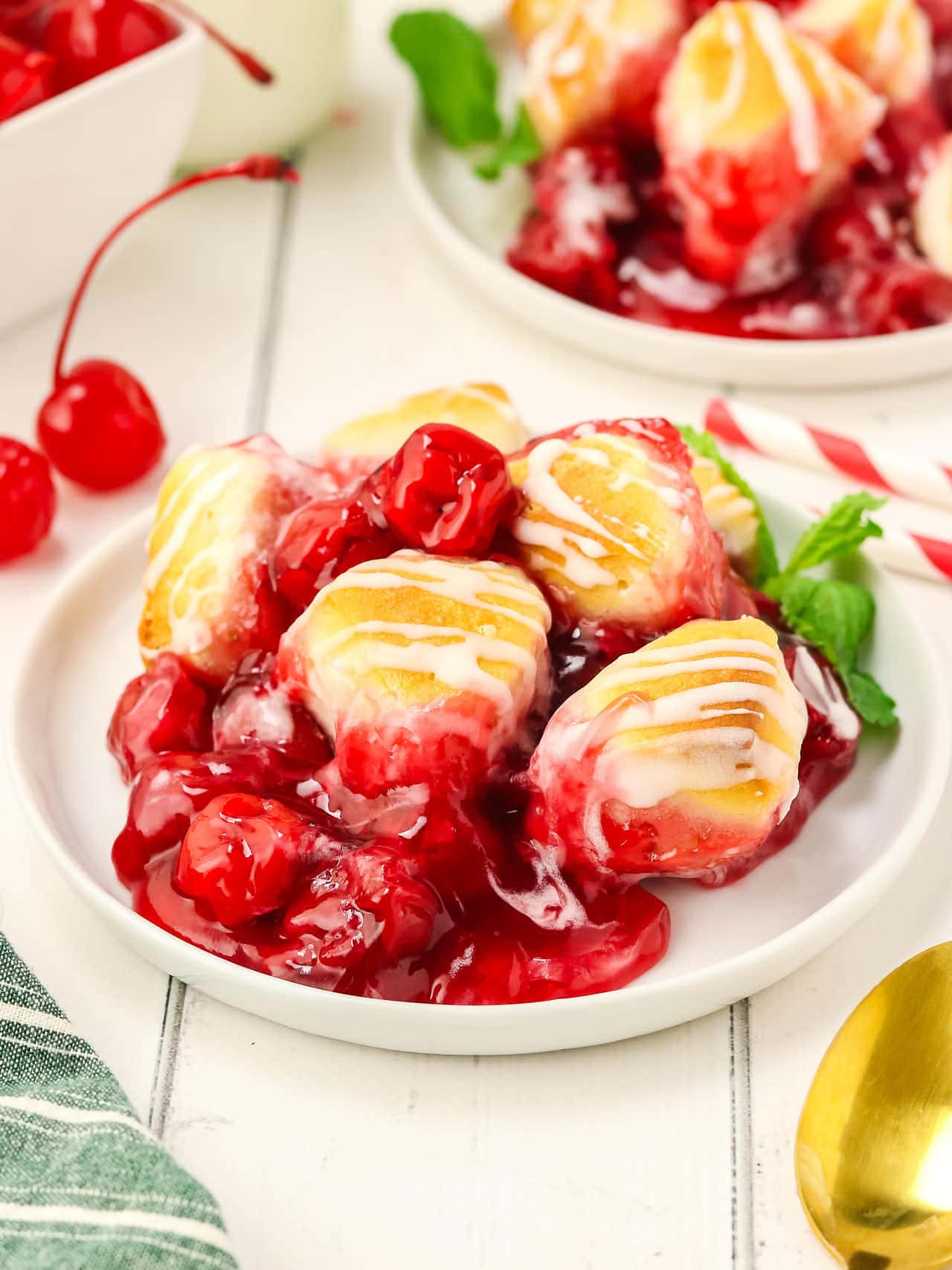 Freshly baked Cherry Cobbler served on a white plate.