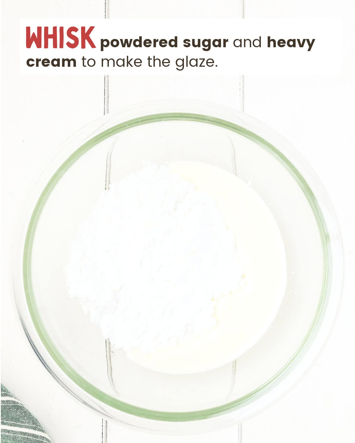 Heavy cream and powdered sugar in a mixing bowl.
