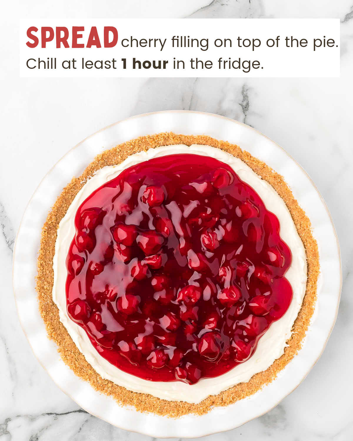 Cherry cream cheese pie with graham cracker crust in a white pie plate.