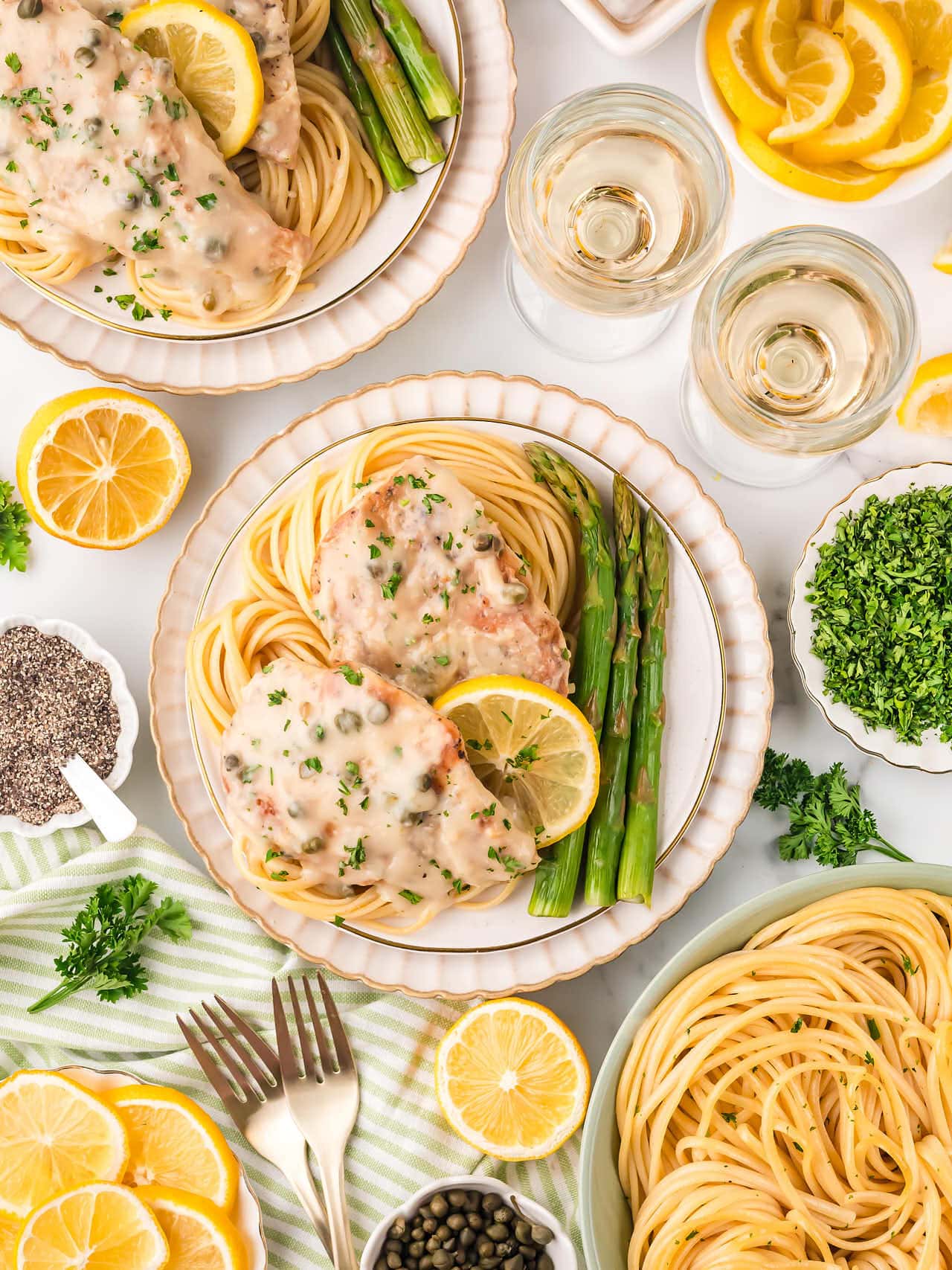 Creamy Chicken Piccata cooked in a white skillet.