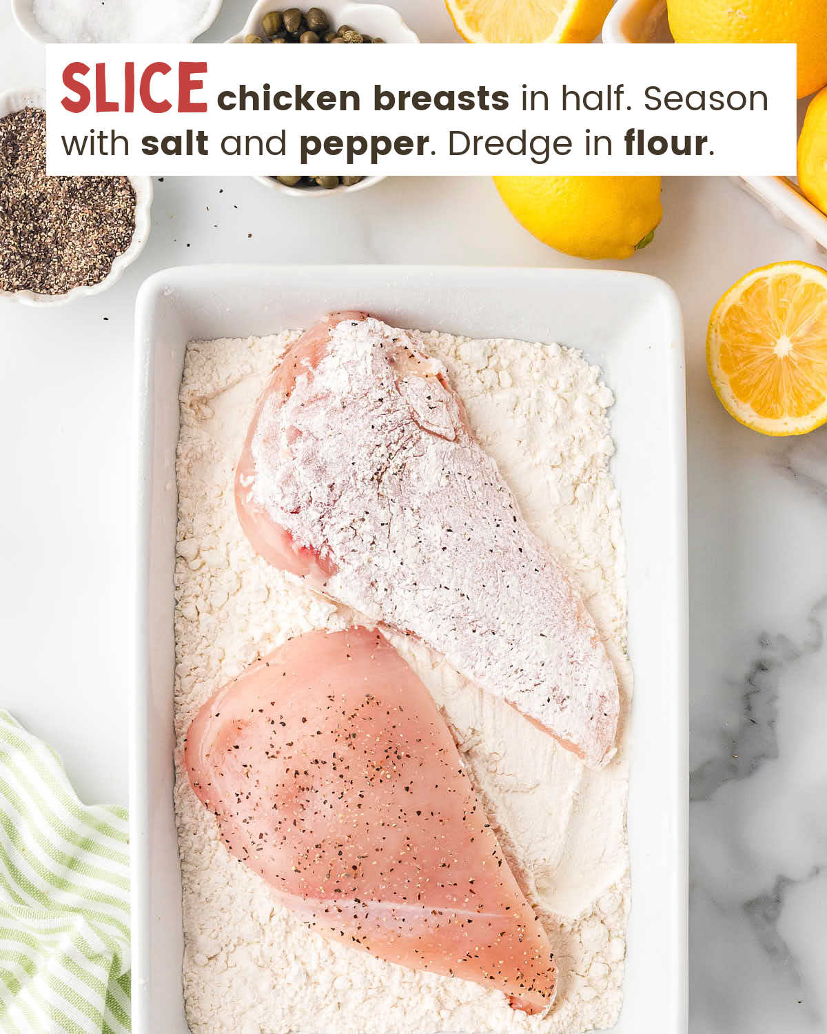 Two chicken breasts on a  rectangular plate with flour. One breast has been covered with flour. 