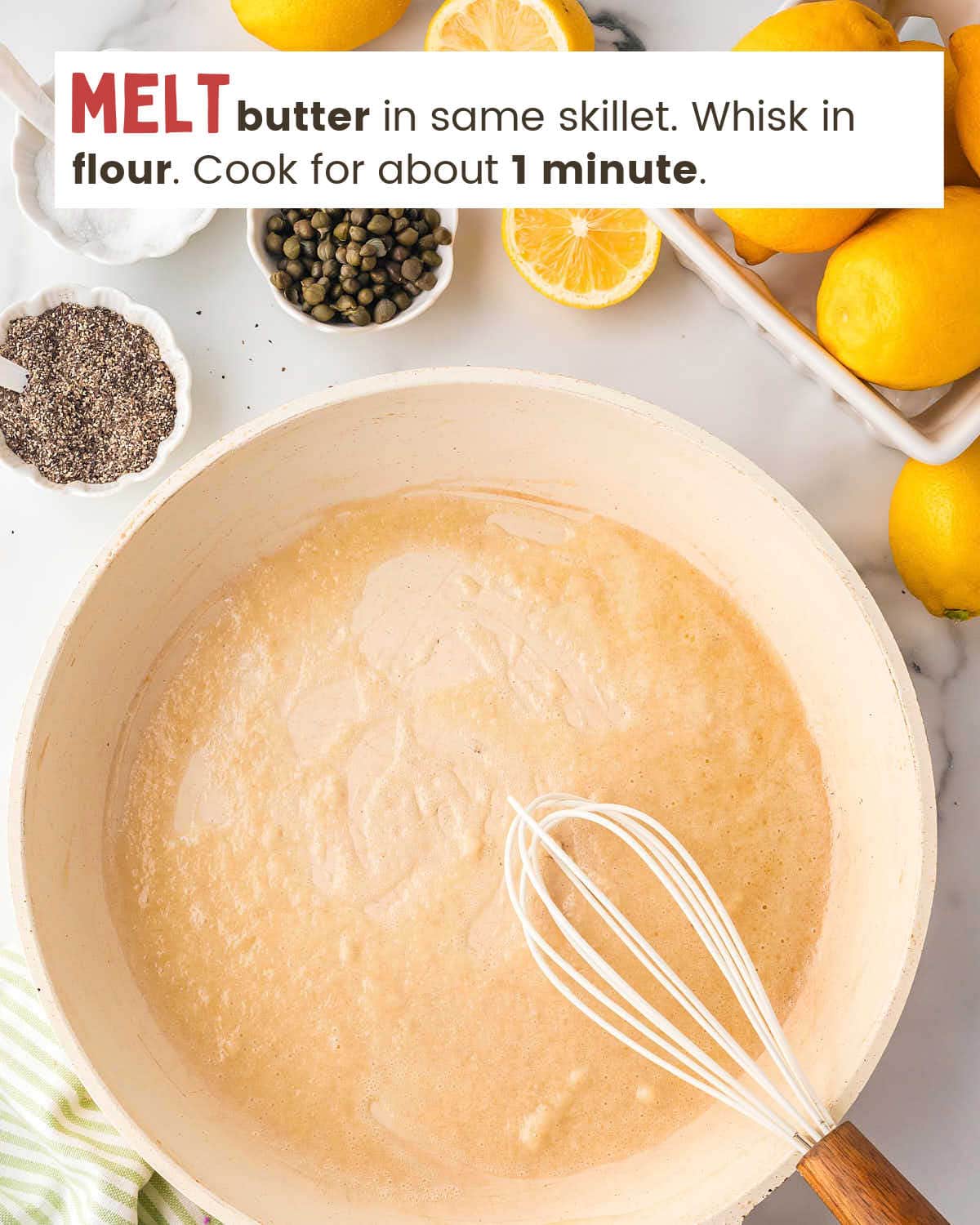 A whisk in a skillet with melted butter and flour.