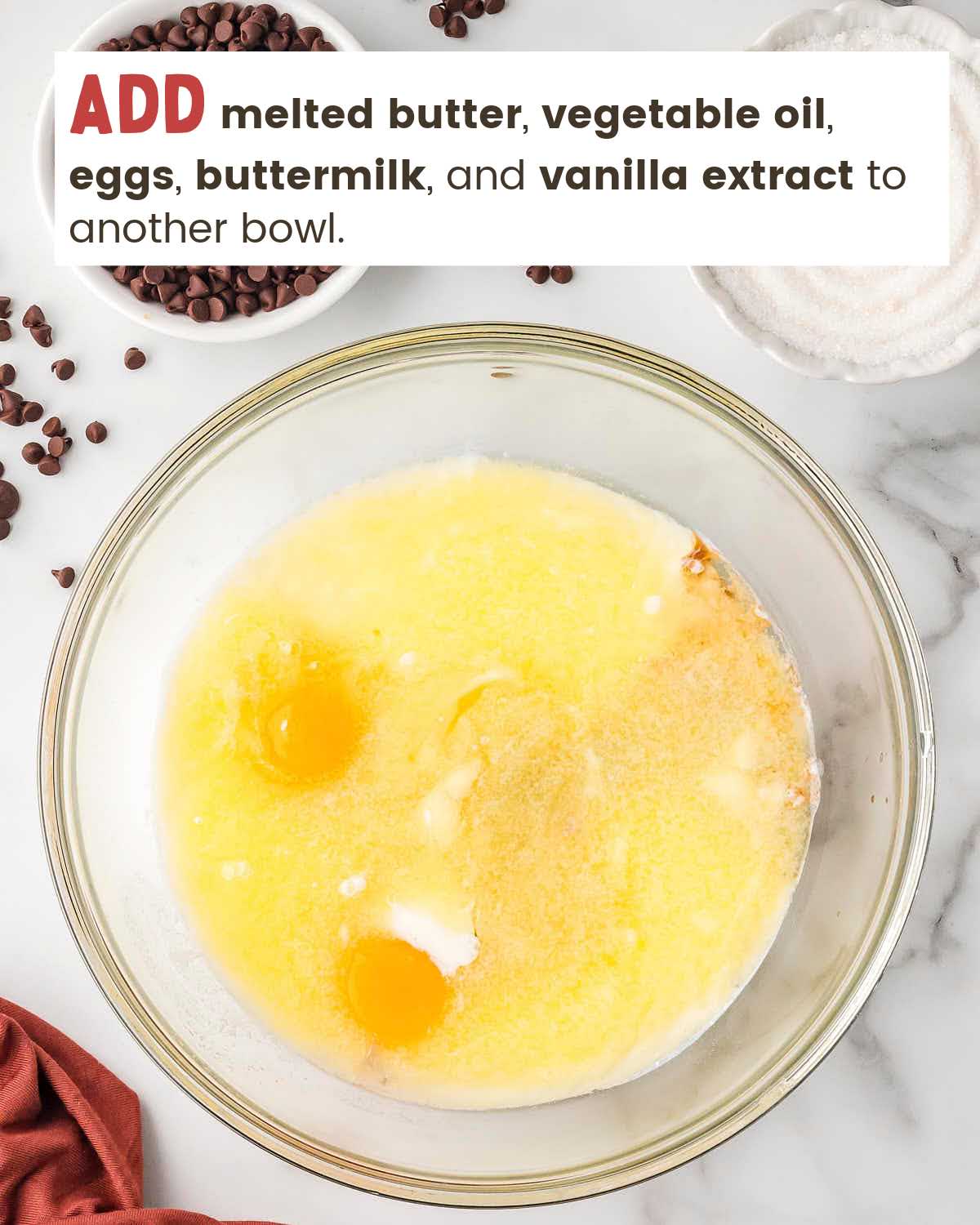 Wet ingredients for muffins in a mixing bowl.