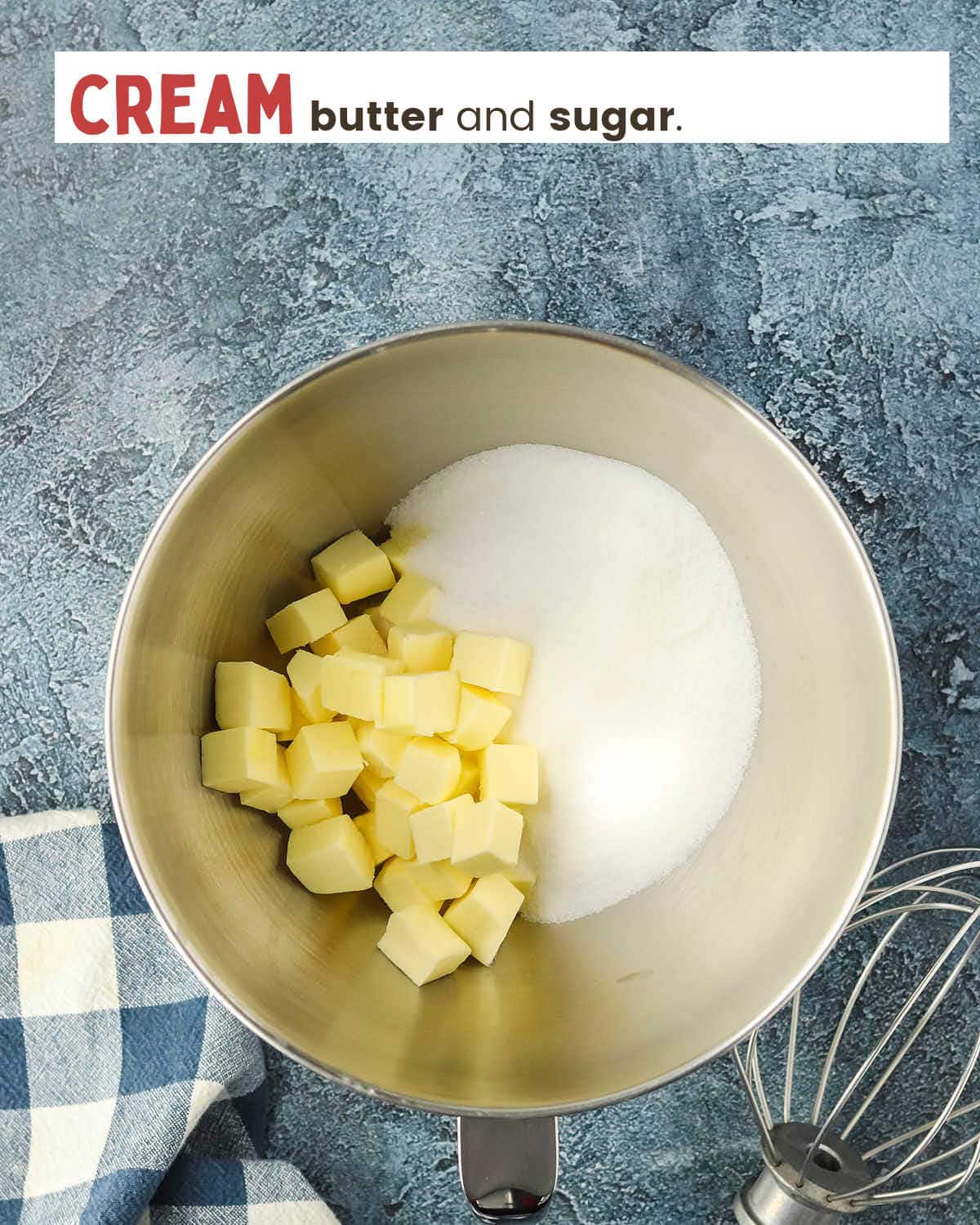 Cubed butter and sugar in a mixing bowl. 
