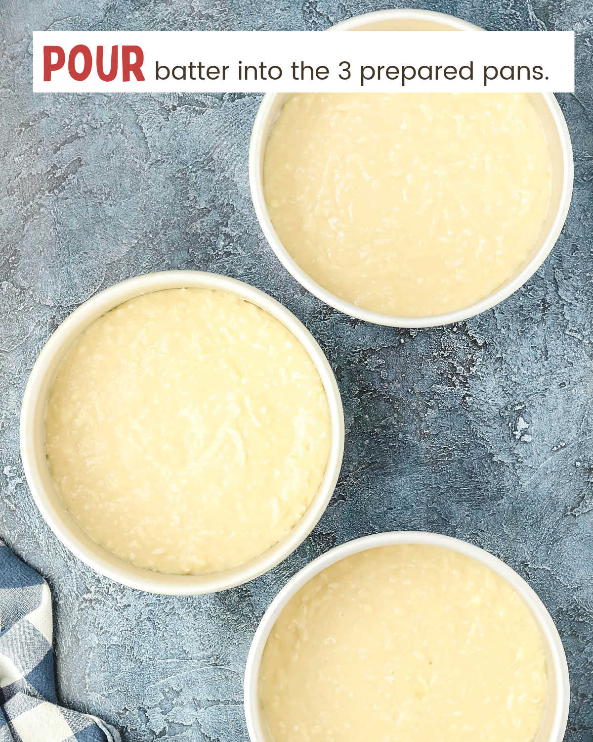 Cake batter in 3 cake pans.