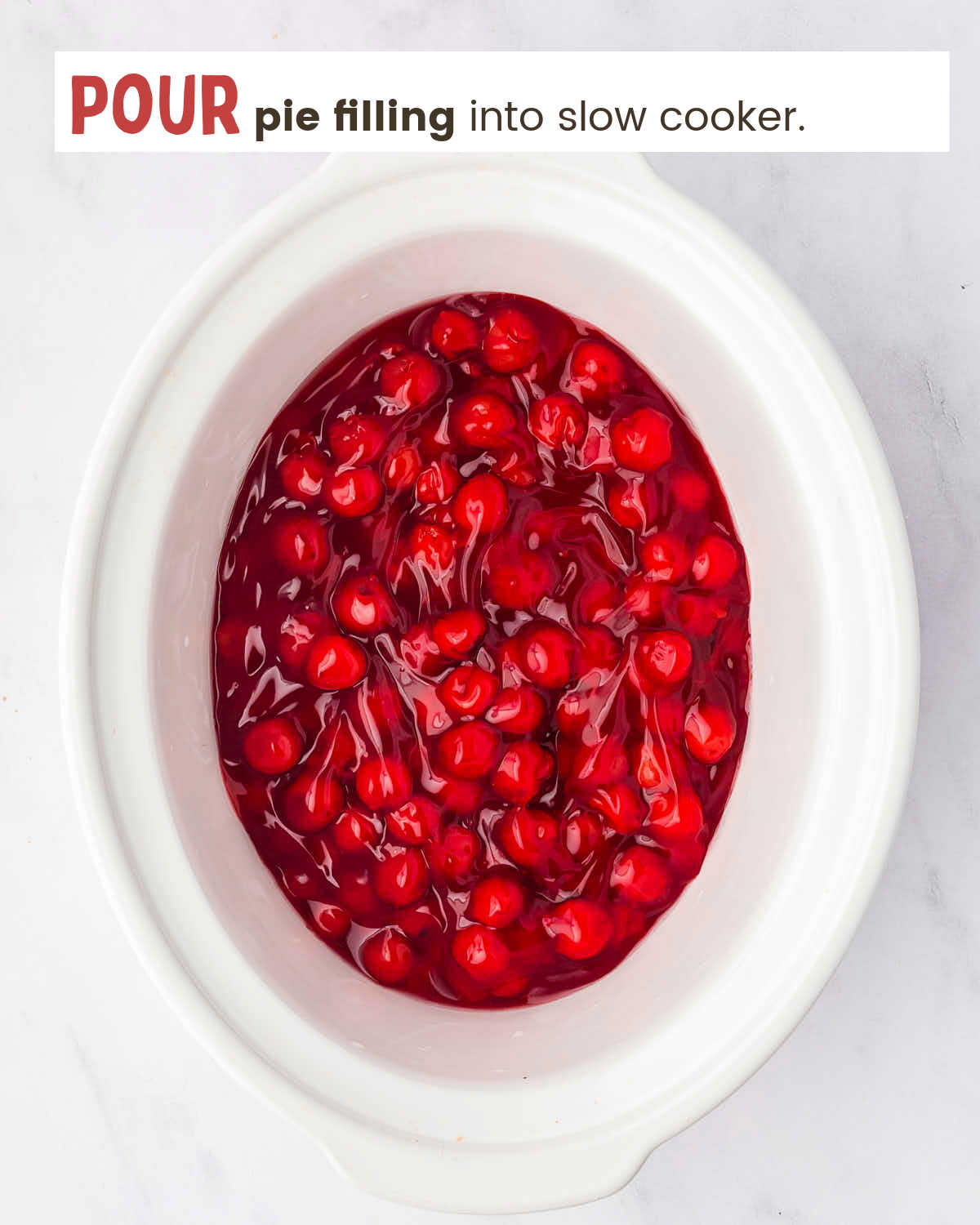 Cherry pie filling in a in Crock Pot.
