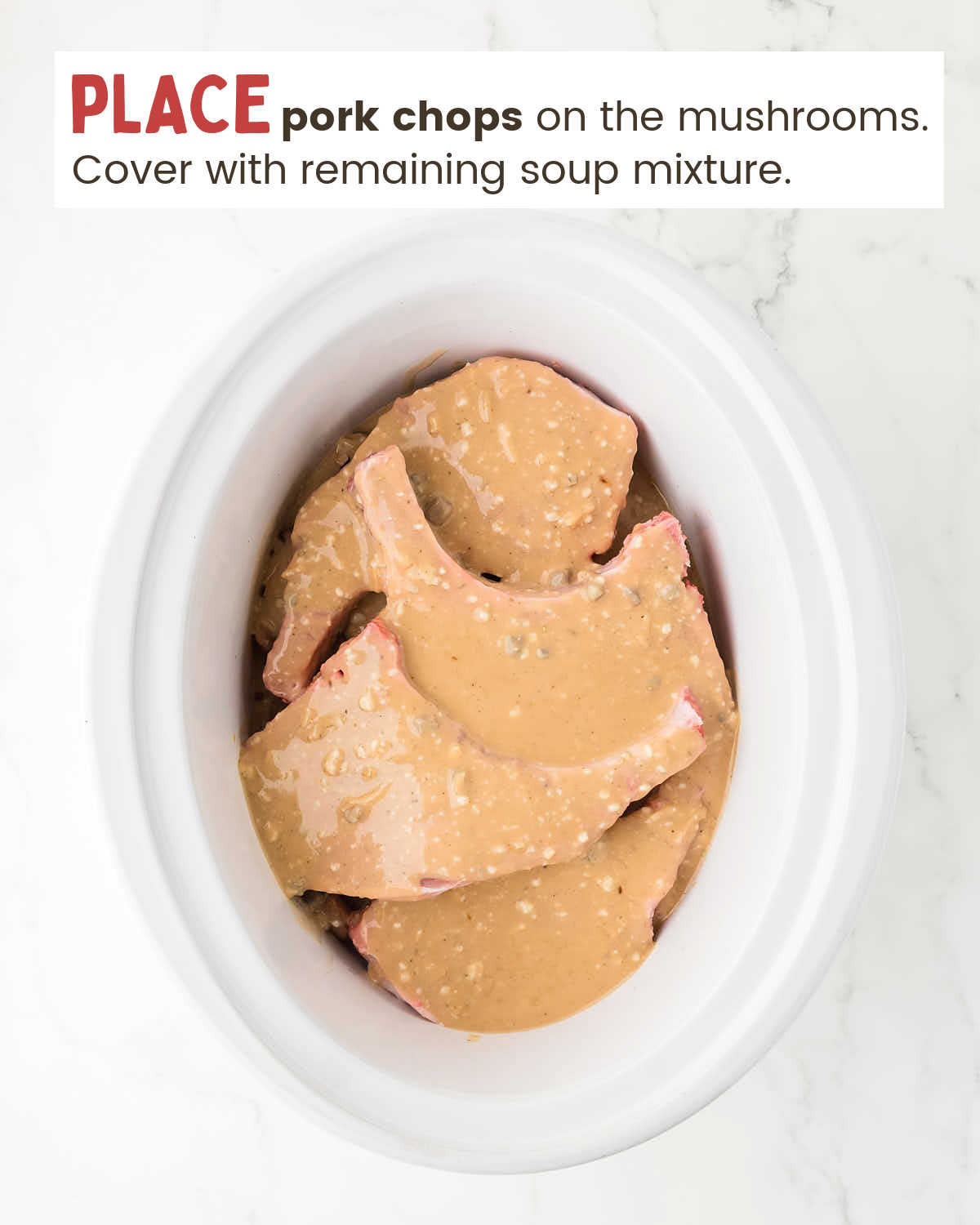 Pork Chops in a slow cooker covered with soup mixture.