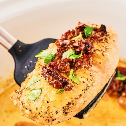 A spoonful of a slice of Crockpot Marry Me Chicken.