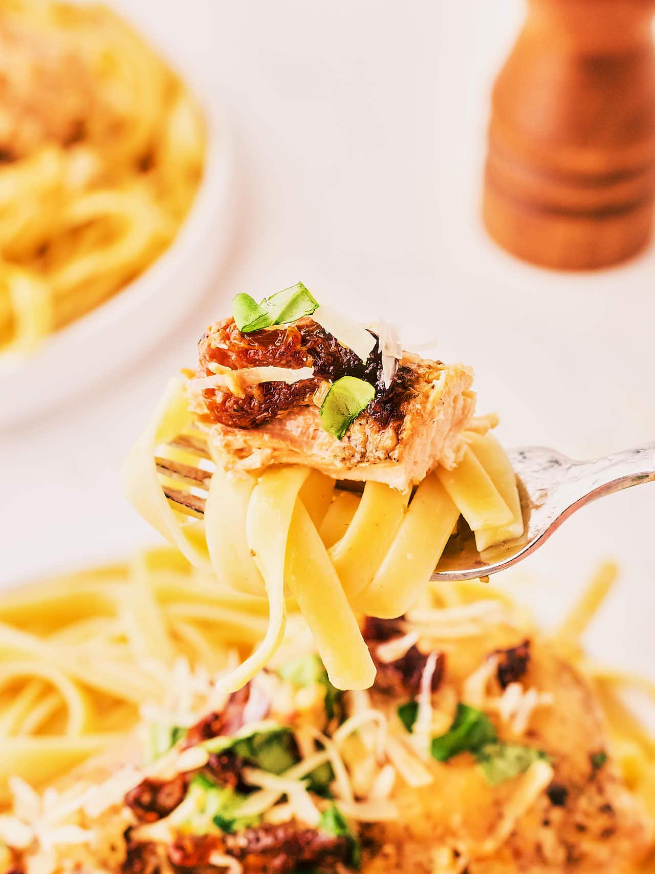 A forkful of Marry Me Chicken made in a Crockpot.