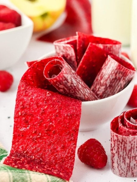 Homemade Fruit Roll Ups in a white bowl.