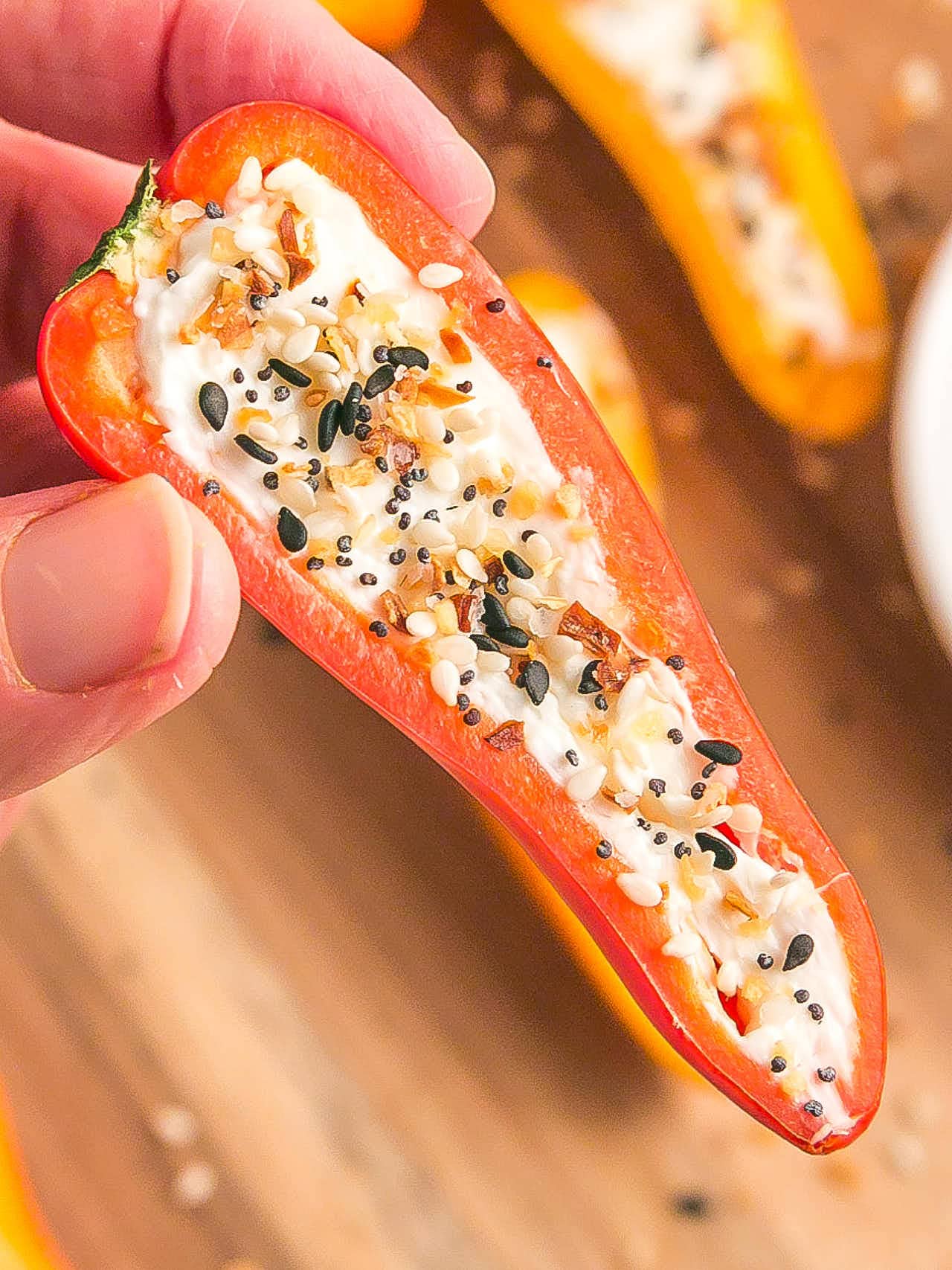 Holding up a Stuffed Mini Peppers.