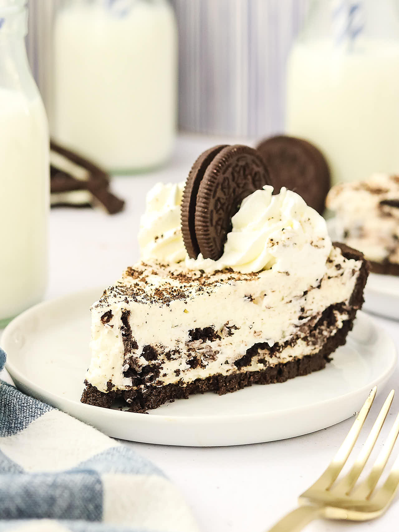 A slice of Oreo Pie on a white plate.