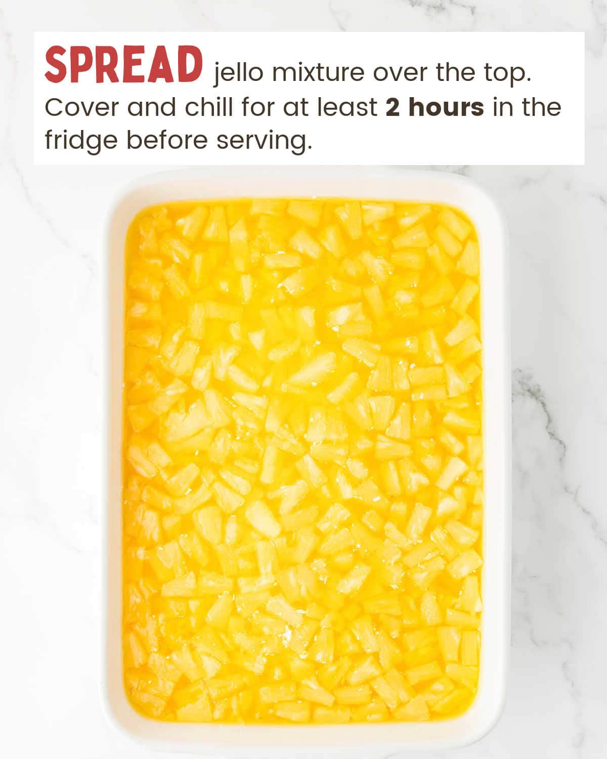 Pineapple layer of a pineapple pretzel salad in a baking dish.