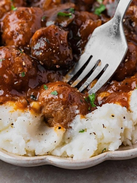 A forkful of Salisbury Steak Meatballs and mashed potatoes.