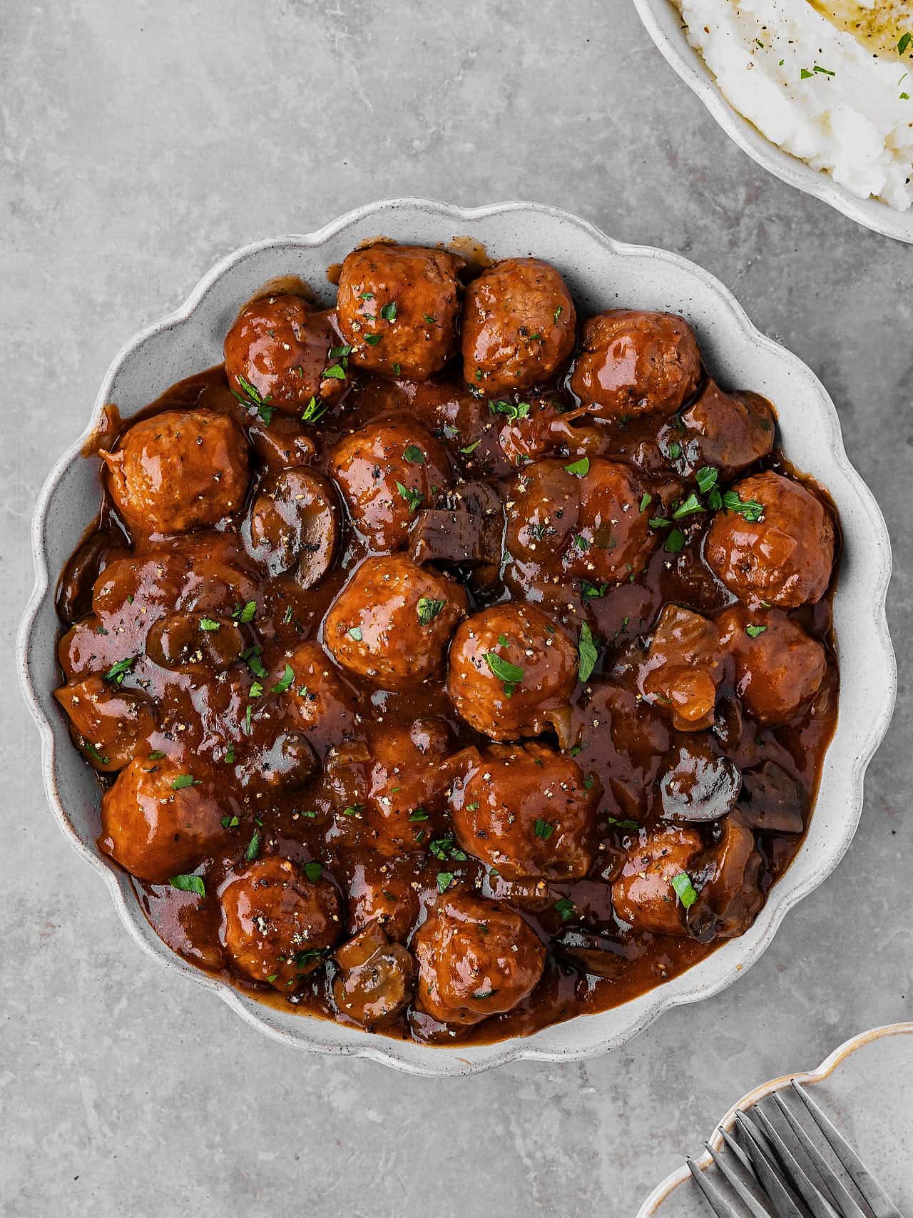 Topdown view of a bowl of Salisbury Steak Meatballs made in a Crockpot. 
