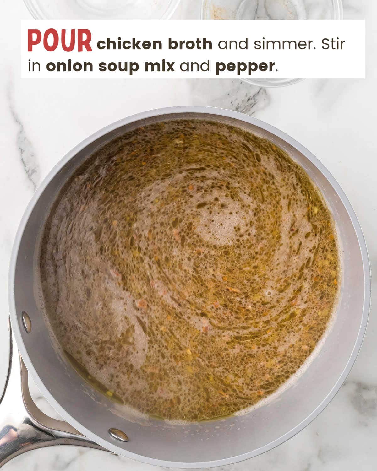 Chicken broth with soup mix in a pot.