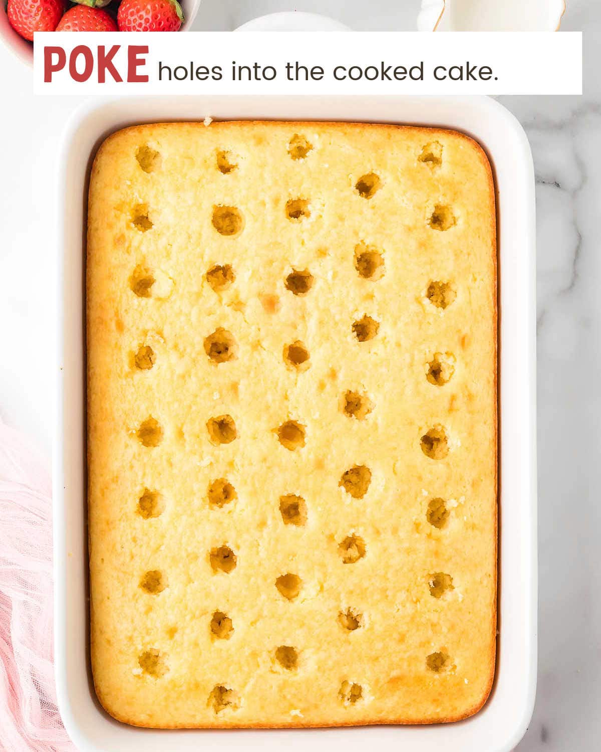 Baked cake with holes poked into it.