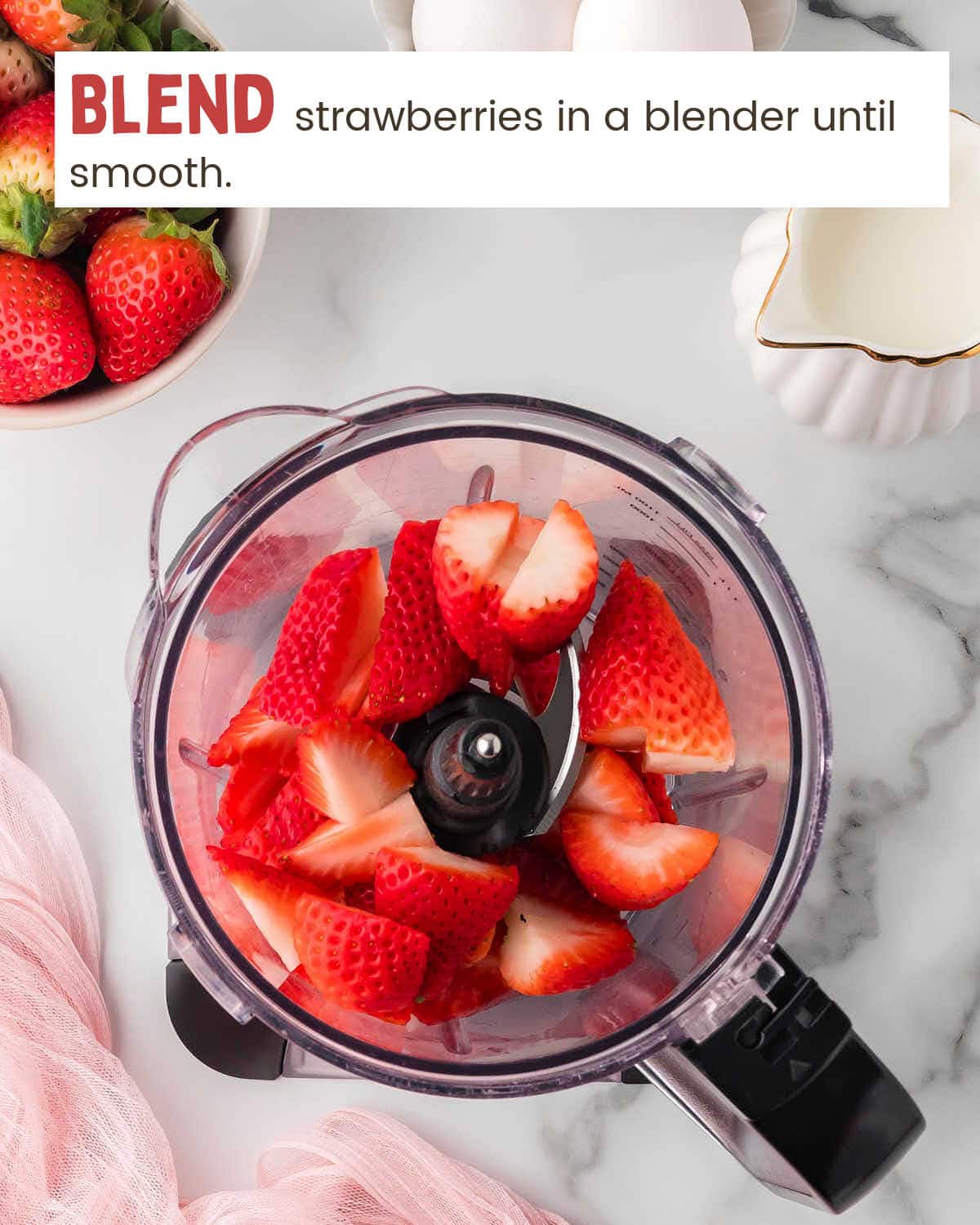 Top view of strawberries in a blender.