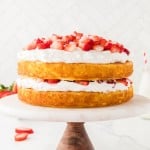 Easy Strawberry Shortcake on a beautiful marble cake stand.