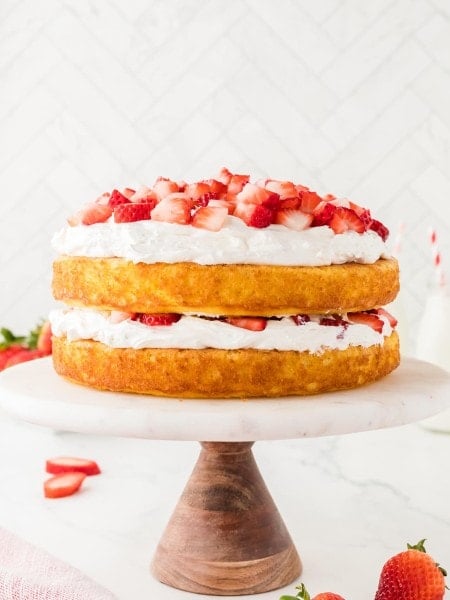 Easy Strawberry Shortcake on a beautiful marble cake stand.
