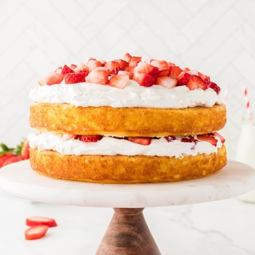 Easy Strawberry Shortcake on a beautiful marble cake stand.