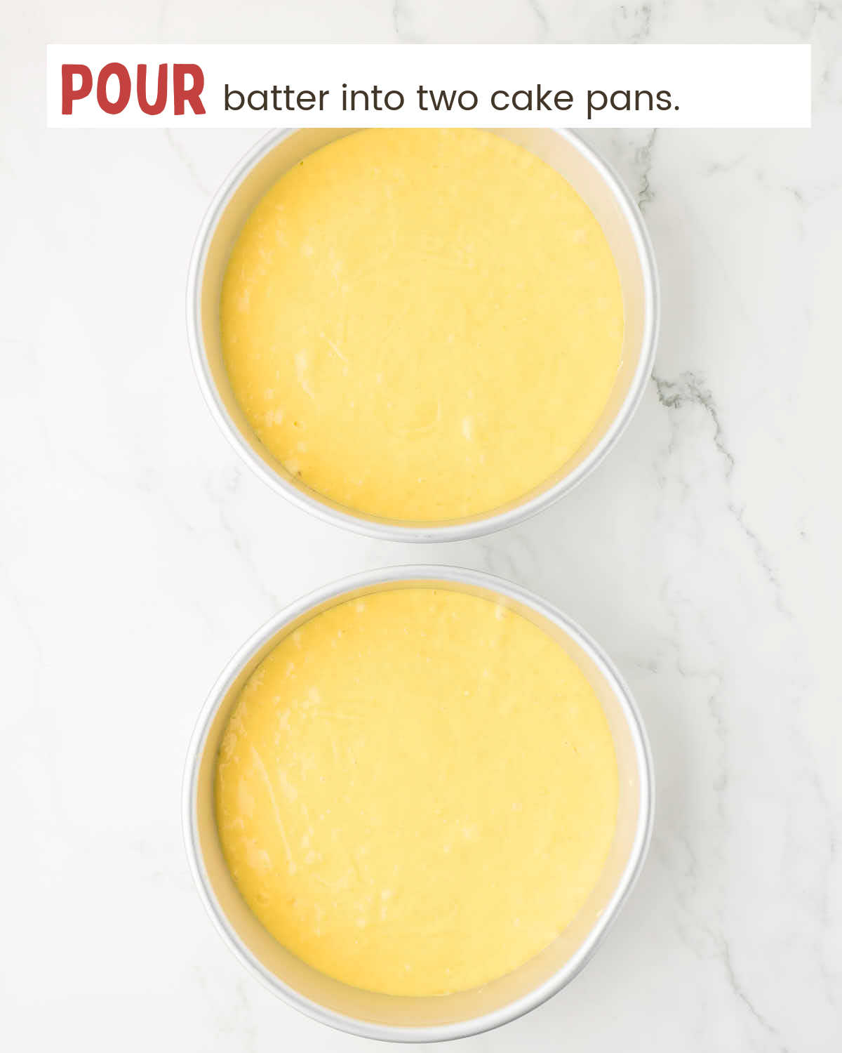 Two round cake pans filled with cake batter.