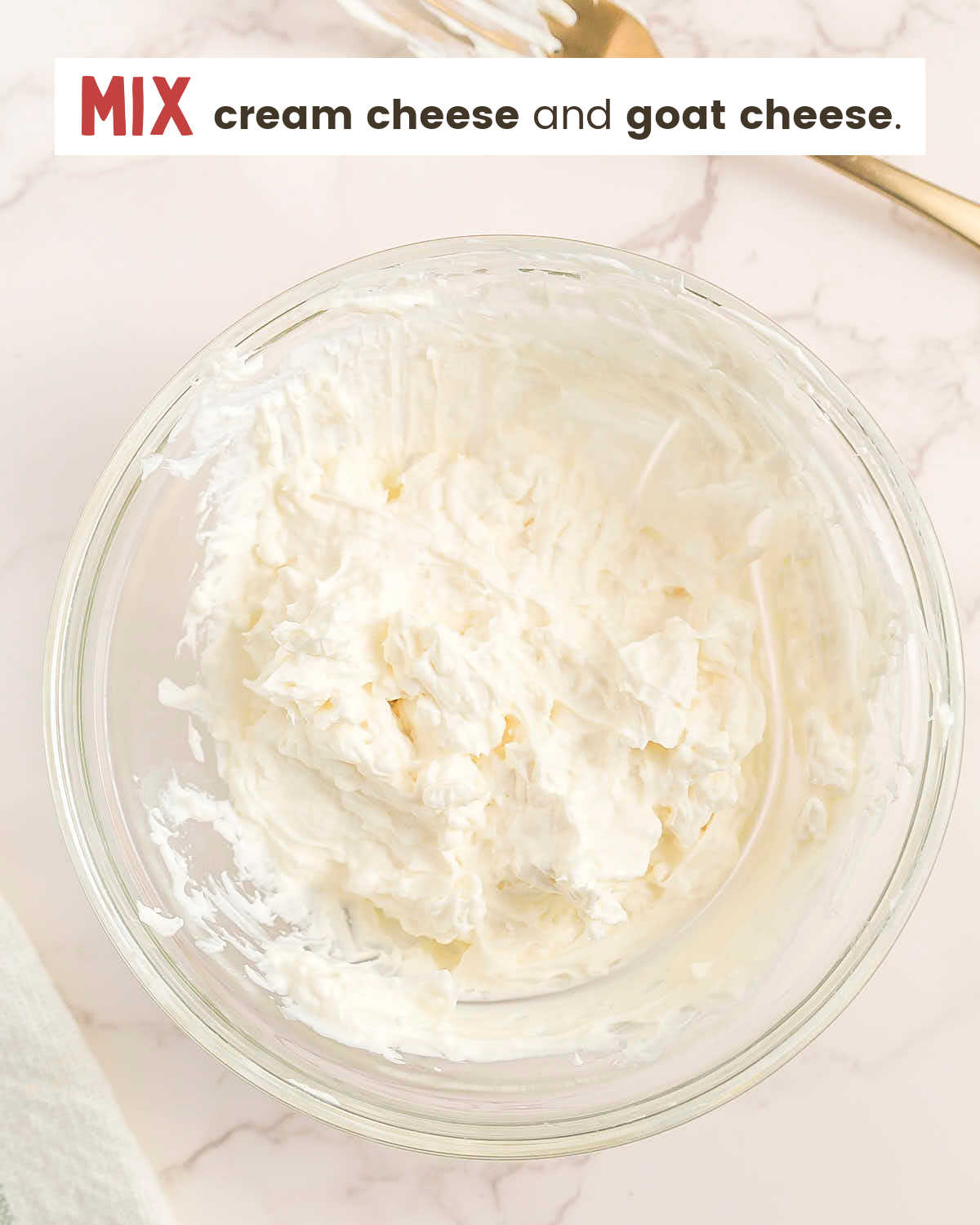 Cream cheese and goat cheese mixed in a bowl.