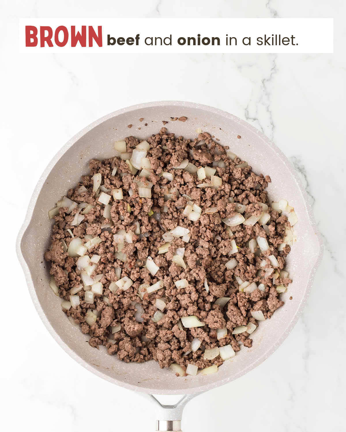 Browned beef and chopped onion in a skillet. 