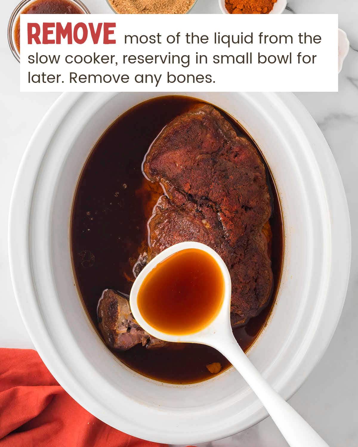 Pork shoulder in a slow cooker with a ladle lifting some of the cooking liquid.
