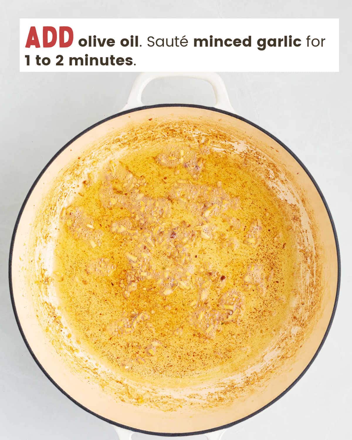 Olive oil and minced garlic in a pan.