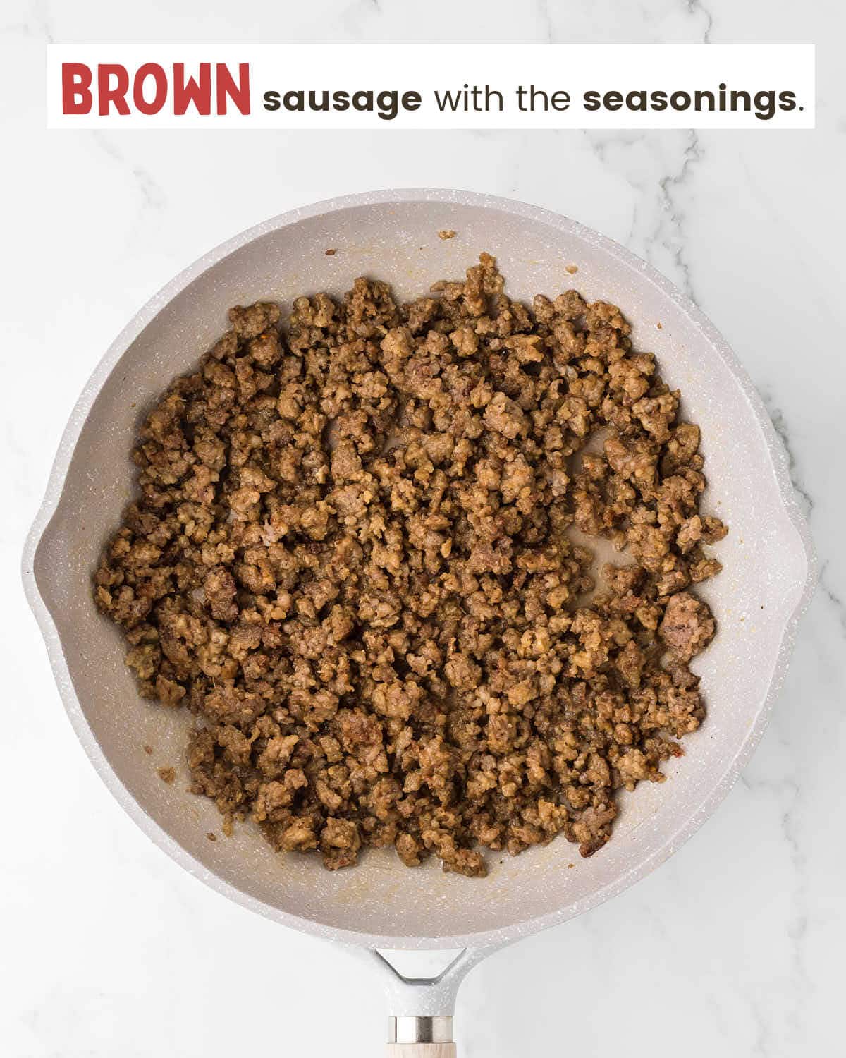 Ground sausage with seasonings in a skillet.