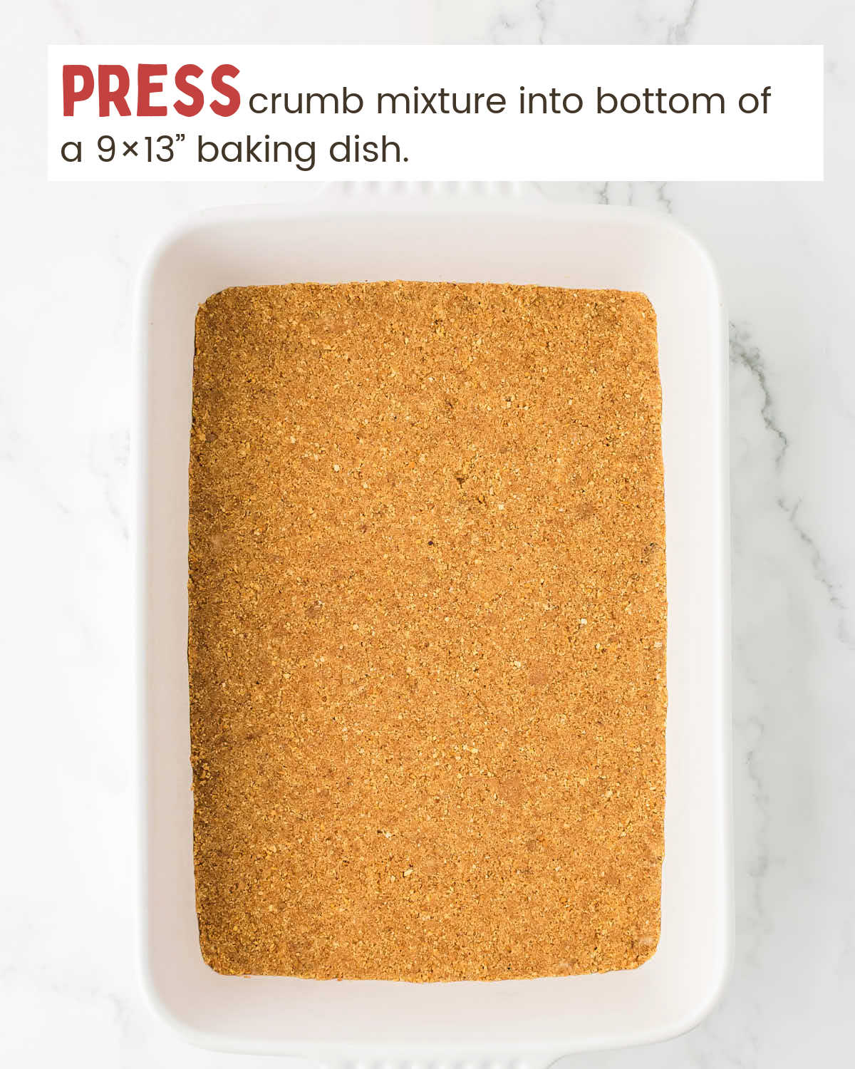 Graham cracker crumb mixture pressed into a baking dish.