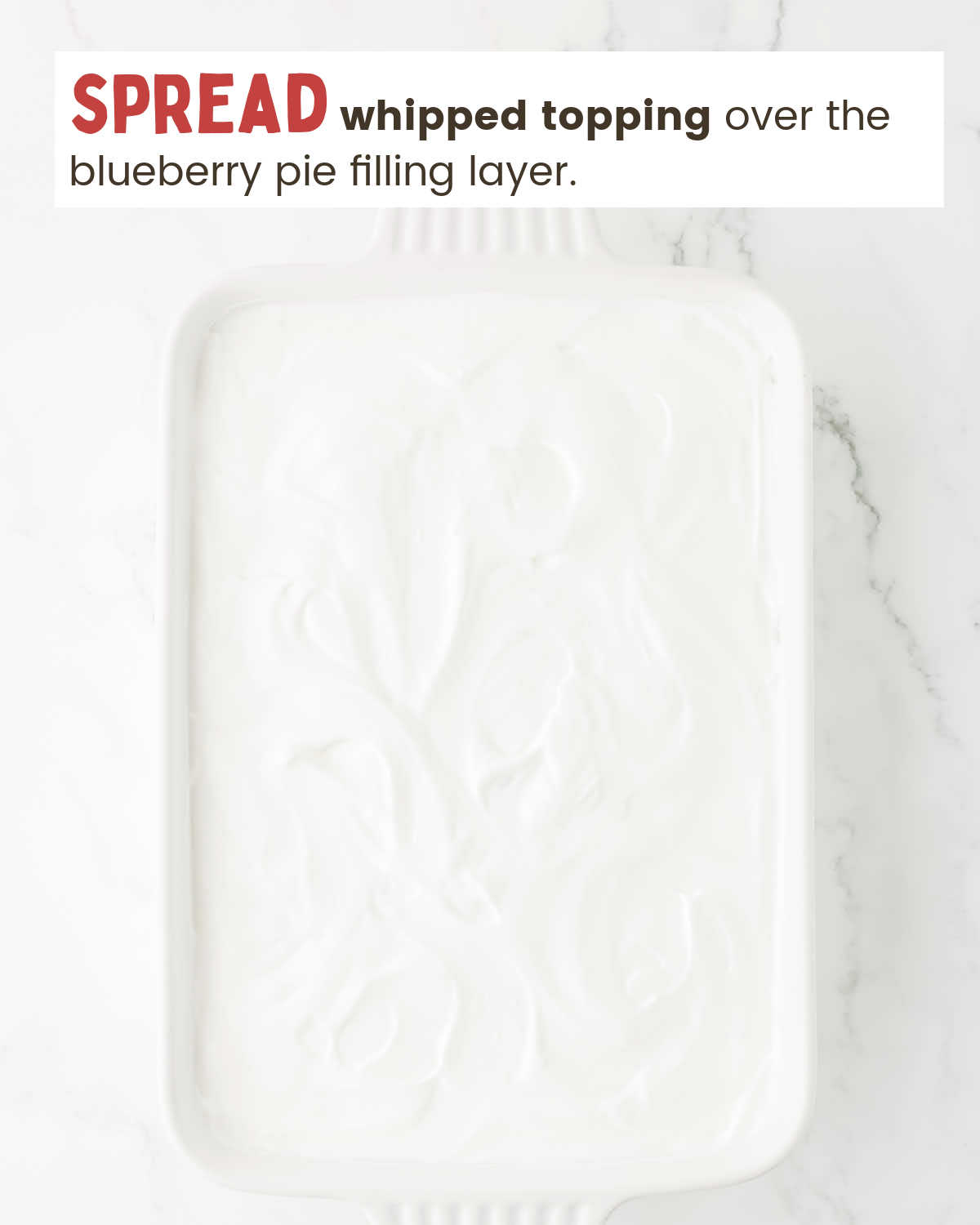 Whipped topping layer in a baking dish.