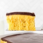A slice of Boston Cream Cake recipe by Cheerful Cook.