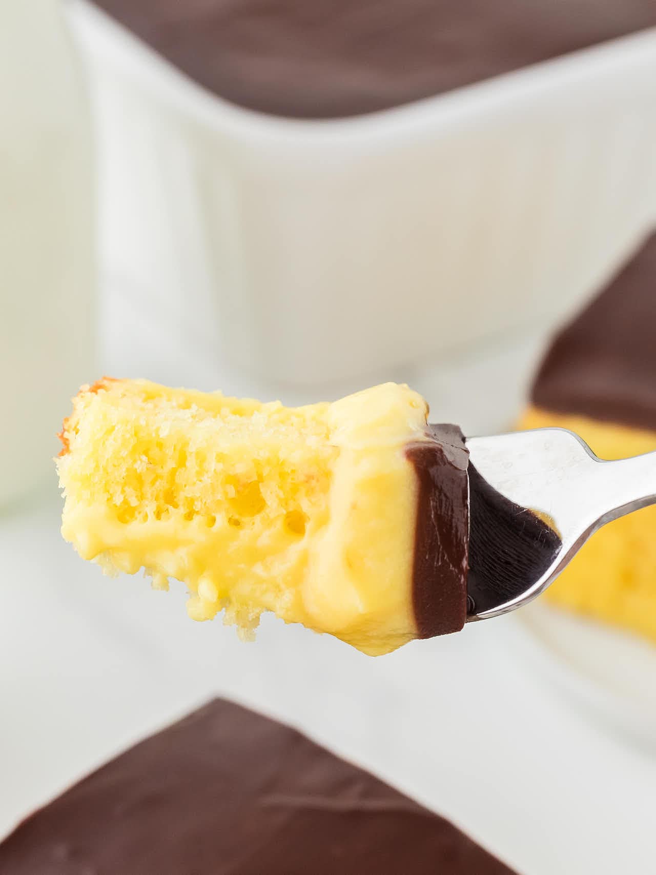 A forkful of Boston Cream Poke Cake. 